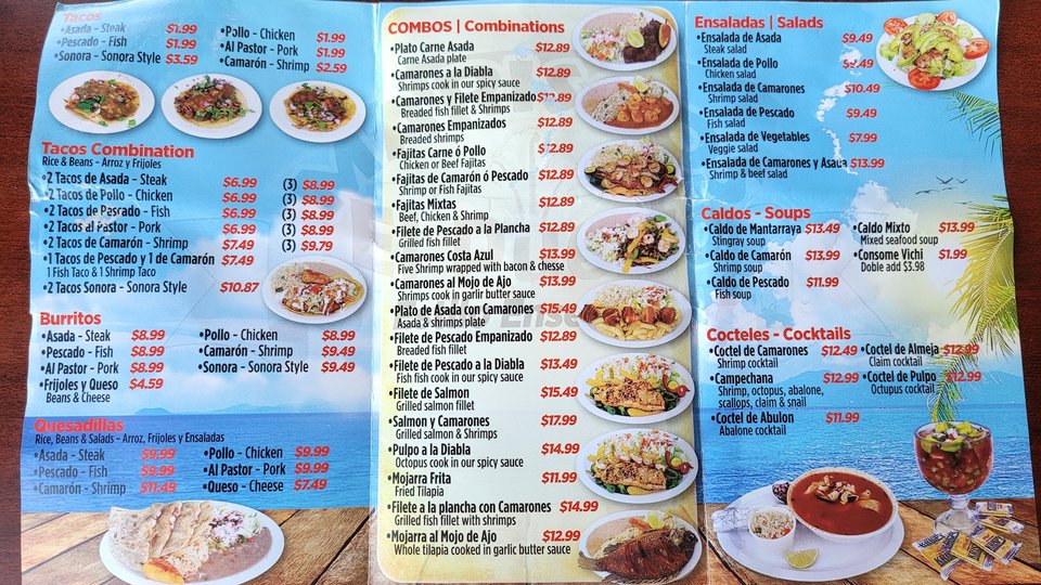 Colorful mariscos dishes with lime and salsa.